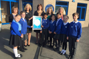 Children and staff at Holywell Primary celebrate their Rights Respecting Schools Award with Secretary of State for Education Nicky Morgan and Unicef UK colleagues Lily Caprani and Frances Bestley.