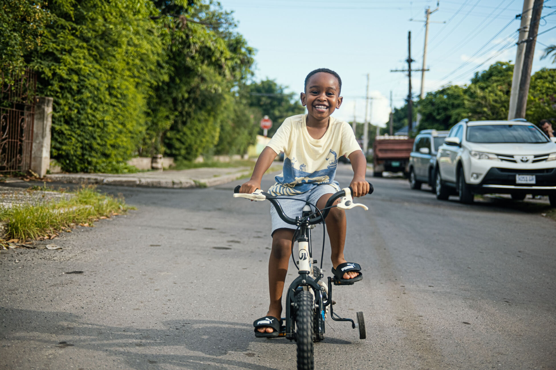 Ari, age six, rides a bike