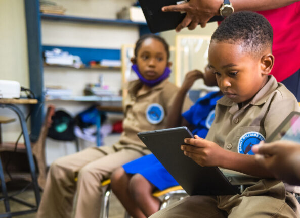 Ari, age 6, uses a tablet